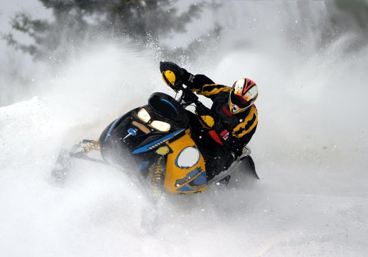 Studding a snowmobile track